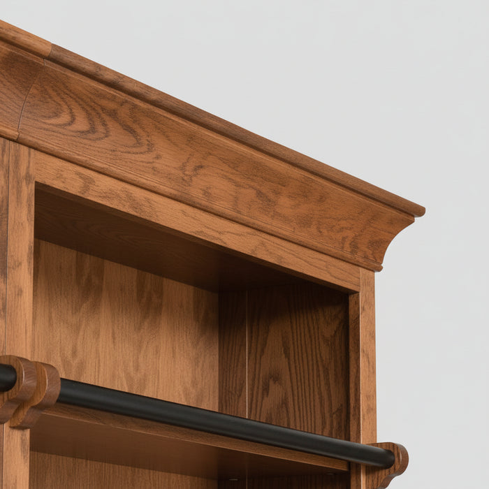 A large wooden bookcase with three bays, featuring dark wood hanging rods across the top of each bay and a matching dark wood ladder leaning against the center-left side, shown on a light gray background.