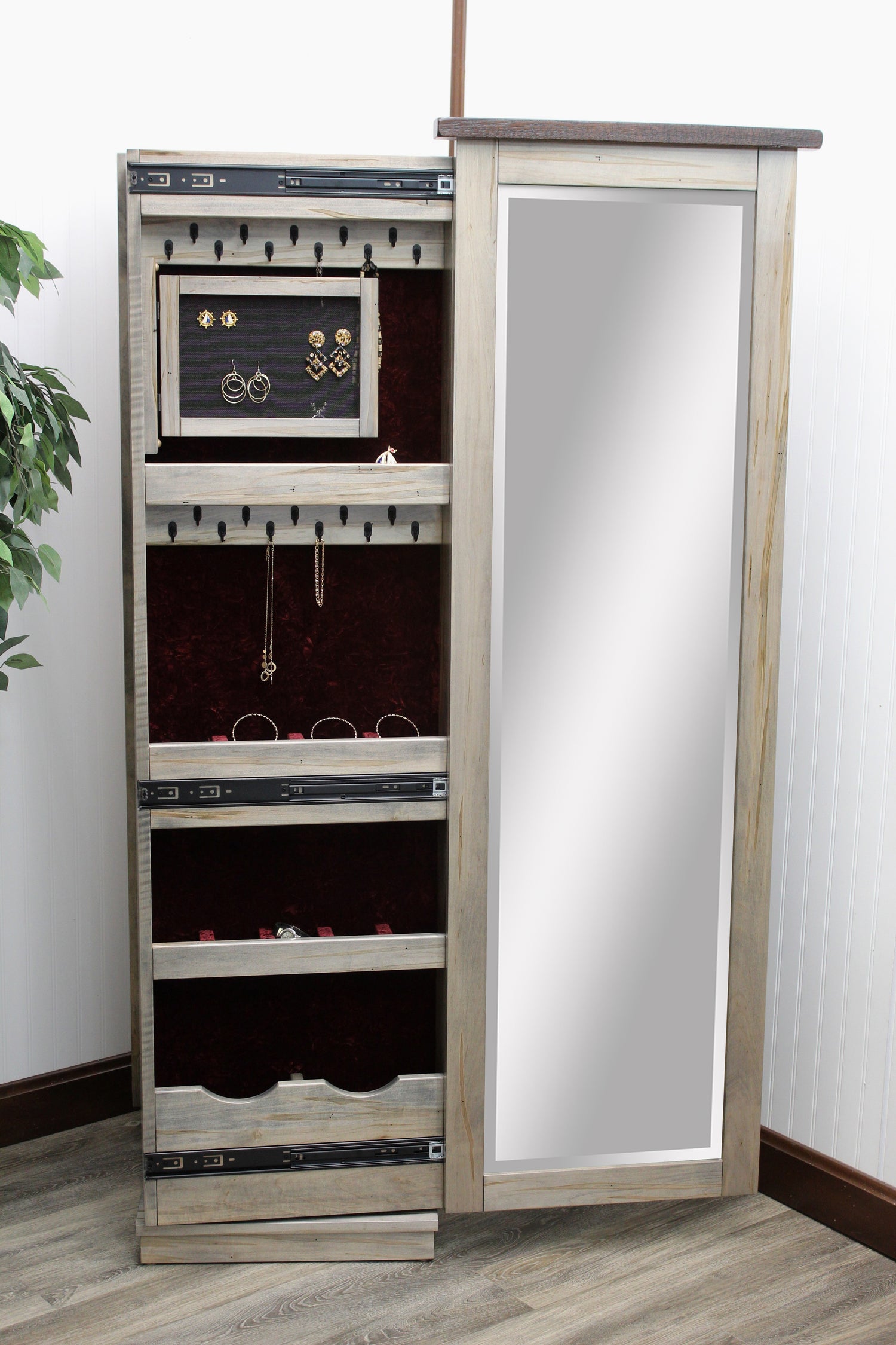 Amish Barn Wood Rotating Jewelry Armoire
16" Lazy Susan in Base Allows 360 Degrees Rotation
8 Velvet-Lined Drawers&nbsp;
Sliding Mirror (Slides To The Right Standard)
Hinged Earring Door
11 Hook Necklace Board