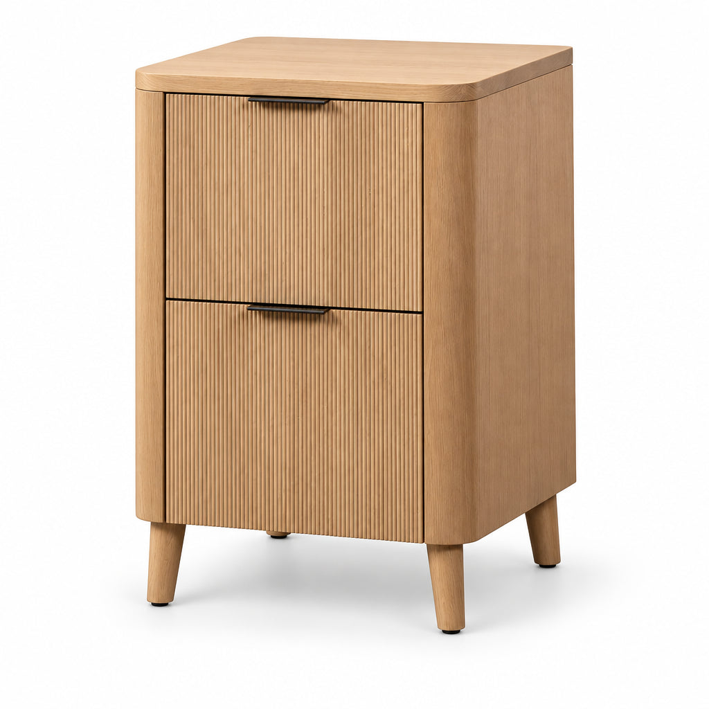 A light natural wood two-drawer file cabinet with a ribbed drawer front, rounded top corners, and tapered legs, shown on a plain white background.