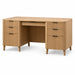 A mid-century modern wooden writing desk with a light oak finish, featuring three drawers on each side and a single open drawer in the center. The desk is styled with a woven basket bowl and two white ceramic vases on top, set against a solid white background.