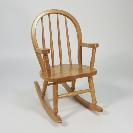 A traditional wooden Amish Bowback Kid's Rocker chair with a curved backrest and armrests on a curved rockers base.