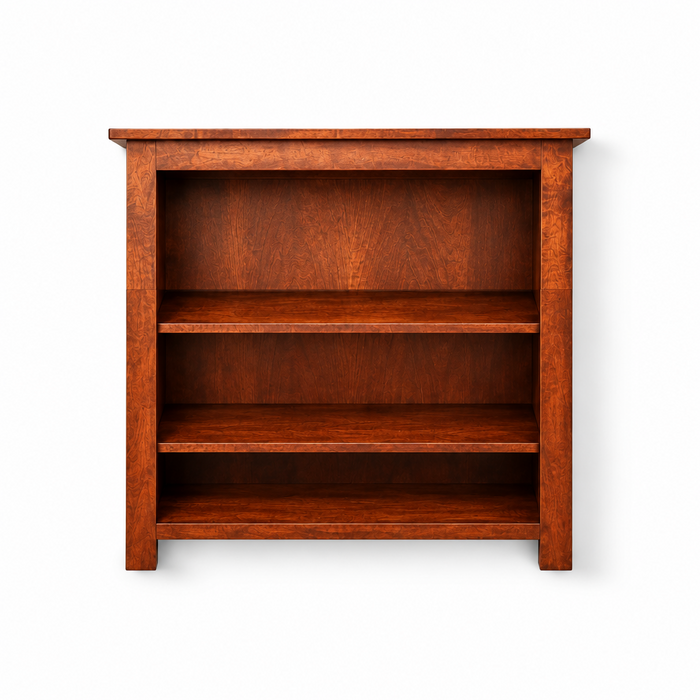 A three-tier wooden bookcase with a warm reddish-brown finish, shown against a plain white background.