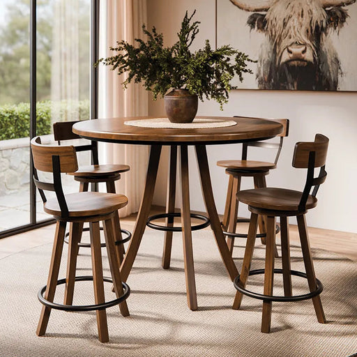 A round wooden dining table with four matching wooden bar stools featuring black metal legs, set in a modern dining room with a cow print wall art and a large window.