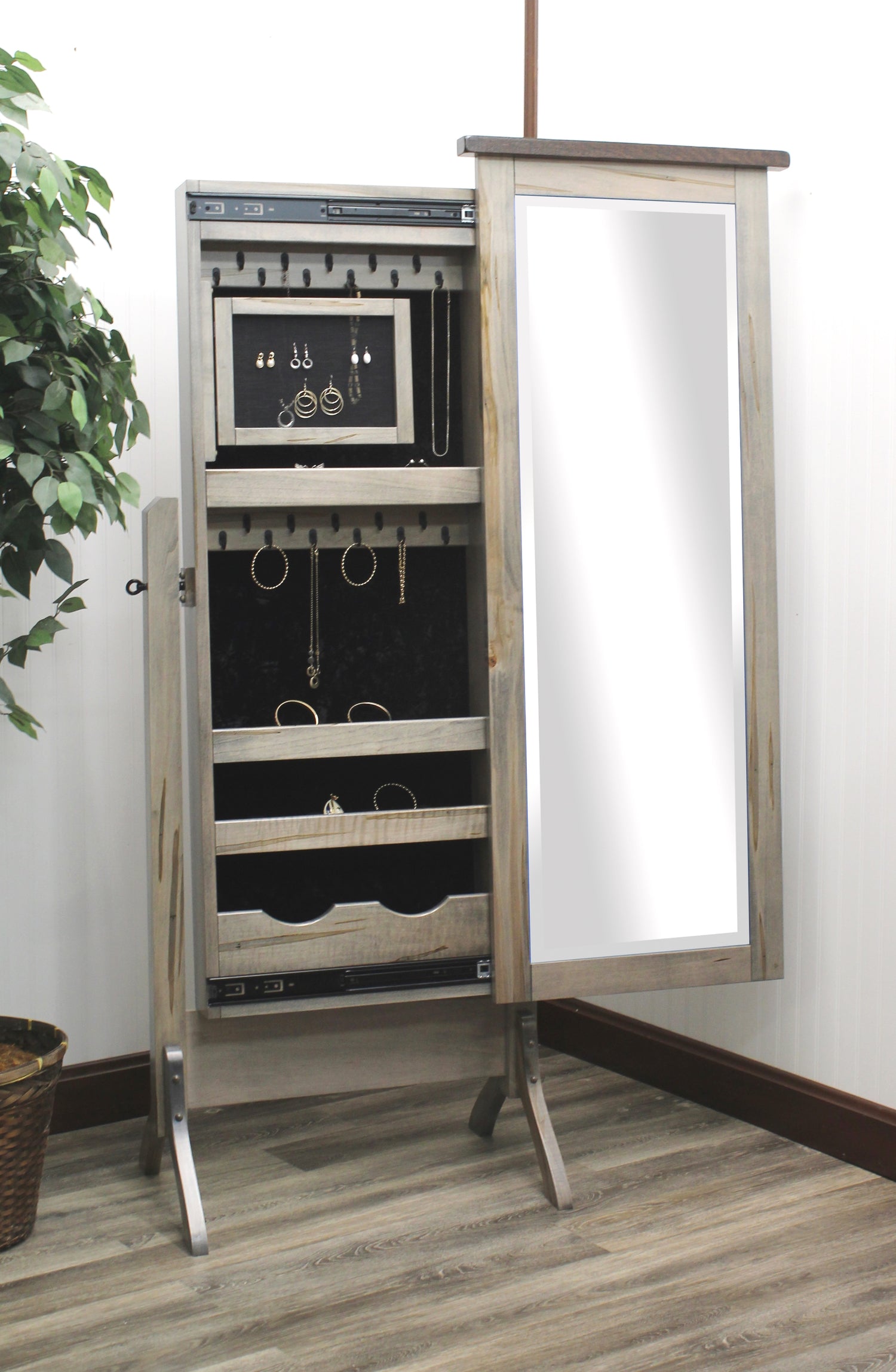 Amish ERD Barn Wood Top Jewelry Cheval Mirror
 Sliding Mirror (Slides To The Right Standard)
Hinged Earring Door
11 Hook Necklace Board
1st Shelf: 3 Ring Slots
2nd Shelf: 3 Dividers
3rd Shelf: 4 Dividers
Bottom Shelf: 1 Divider 