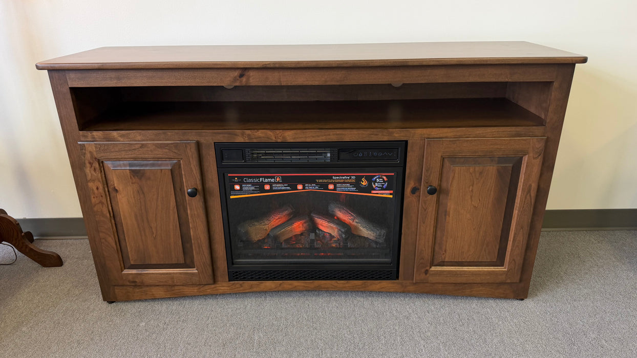 Wooden entertainment console with built-in electric fireplace on a carpeted floor.