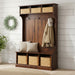 Wooden hall tree with storage baskets and hooks on a white background