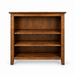 A three-tier wooden bookcase with a warm medium-brown finish and visible wood grain, shown against a plain white background.
