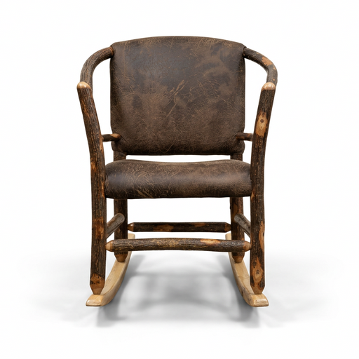 A rustic wooden rocking chair with a dark brown distressed leather seat and backrest, positioned in front of closed paneled doors on a gray carpet.