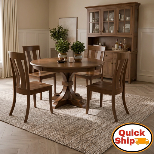 An oval wooden dining table with a matching four-piece chair set in a warm brown finish, shown in a dining room setting with a plant centerpiece and a 'Quick Ship' badge overlay in the bottom right corner.