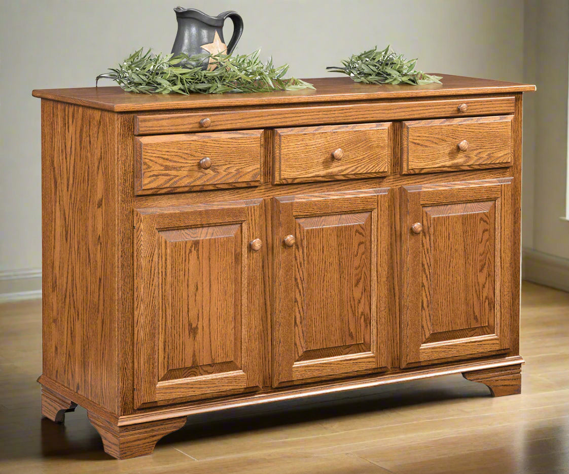 Amish Landsbury 3-Door Buffet
Hardware: 1.25 Wood Knobs
1 Adjustable Wood Shelf