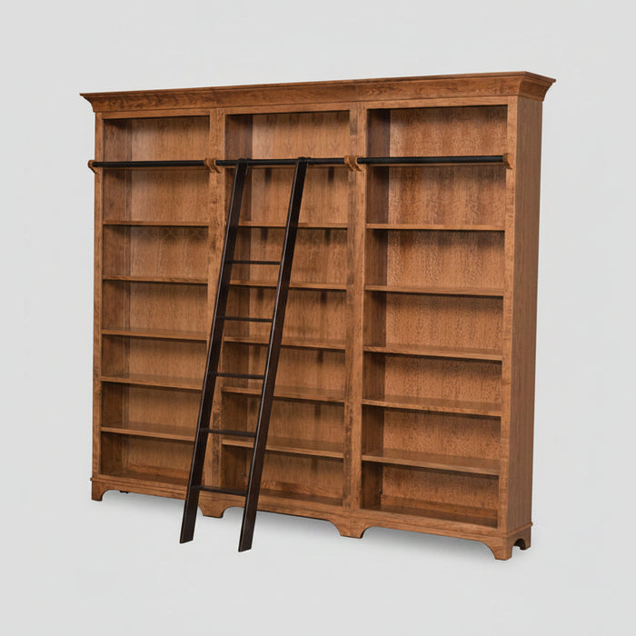 A large wooden bookcase with three bays, featuring dark wood hanging rods across the top of each bay and a matching dark wood ladder leaning against the center-left side, shown on a light gray background.