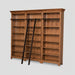 A large wooden bookcase with three bays, featuring dark wood hanging rods across the top of each bay and a matching dark wood ladder leaning against the center-left side, shown on a light gray background.
