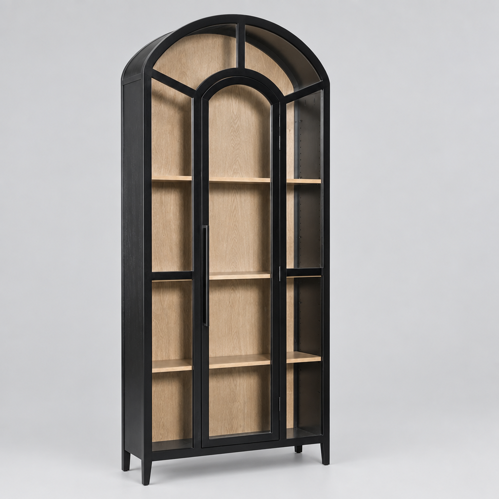 A tall arched bookcase with a black frame and glass doors, showing light wood interior shelves, isolated on a white background.