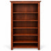 A tall, five-shelf wooden bookcase with a rich reddish-brown finish, photographed in a furniture store showroom.