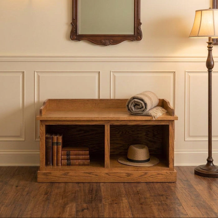 A wooden bench with two open storage compartments, featuring a medium brown oak wood grain finish and a decorative backrest, shown on a solid white background.