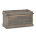 A rustic gray-brown wooden storage bench with a hinged front panel and lift-top design, shown on a plain white background.
