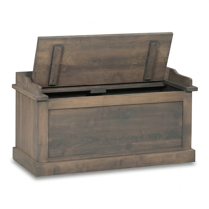 A rustic brown wooden storage bench with its lid propped open, showing a black metal latch mechanism inside. The bench has a weathered wood finish and is isolated on a white background.