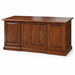 A dark brown wooden desk with a polished top surface, featuring decorative paneling on the front and sides, shown against a plain white background.