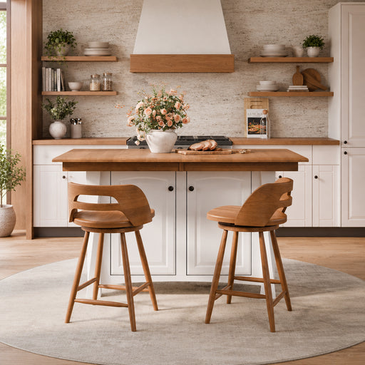 Two wooden bar stools with curved backs are positioned in front of a kitchen island with a light wood countertop and white cabinets.