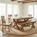 Rustic wooden dining set featuring a rectangular table with an X-brace trestle base, a matching bench, and a single chair with a cross-back design, shown on a plain white background.