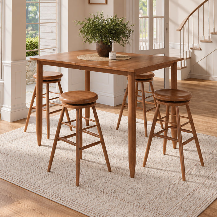 A 5-piece wooden bar-height dining set including a square table and four matching stools, styled in a bright, modern home interior with a staircase and large windows.