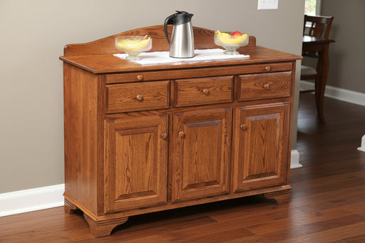 Amish Traditional Server
-Hardware: 1.25" Wood Knobs
1 Adjustable Wood Shelf in Base
Pull Out Server Tray
Sliver ware Drawer (Middle Drawer)
Lined Sliver ware Drawer (Available Felt Colors are Red, Green, Black and Brown