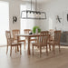 Wooden dining table with six matching chairs Twisted Leg Style on a light gray background