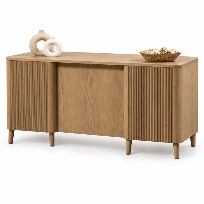 A mid-century modern sideboard cabinet in a light oak wood finish, styled with two white ceramic vases and a woven basket bowl on top, set against a solid white background.