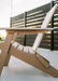 Amish Polybird Folding Adirondack Chair - Weatherwood on Brown - Side View 1