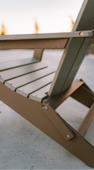 Amish Polybird Folding Adirondack Chair - Weatherwood on Brown - Side View Close Up