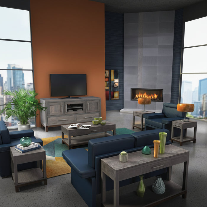 Modern living room with blue sofa, gray coffee table, and TV stand.