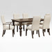 A 7-piece dining room set featuring a rectangular dark brown wooden table with turned legs and six upholstered dining chairs with cream fabric and dark wood frames, shown on a solid white background.